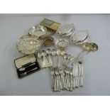 A quantity of silver plate to include entree dishes, a tea tray and flatware