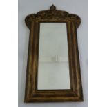 A shaped rectangular wooden framed wall mirror