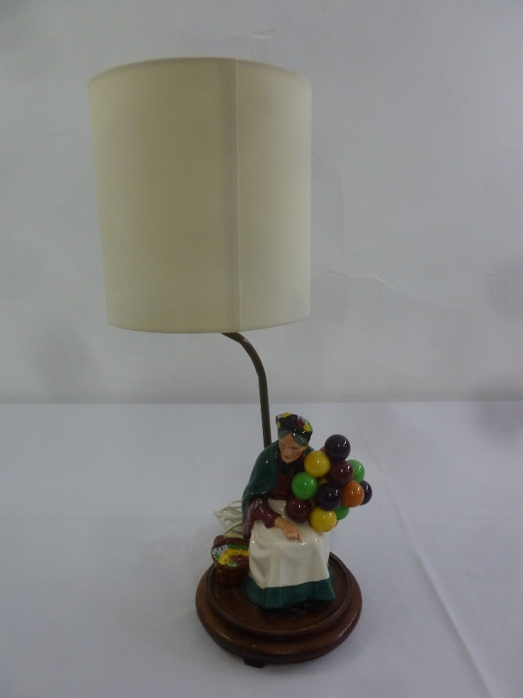 A Royal Doulton figurine of The Old Balloon Seller mounted as a table lamp