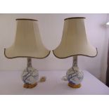 A pair of Porcelain de Paris table lamps with silk shades