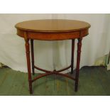 A mahogany oval side table on turned cylindrical legs