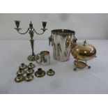 A quantity of silver plate to include an ice bucket, an egg warmer, a mug, a candelabrum, and