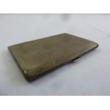 A silver engine turned rectangular cigarette case