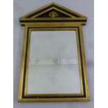 An ebonised and gilded shaped rectangular architectural form wall mirror