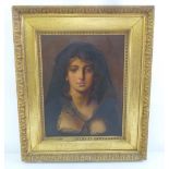 A framed oil on canvas of a lady wearing a scarf, 44.5 x 34.5cm