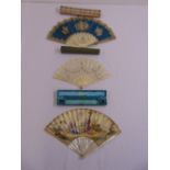 Three French late 18th/19th century hand painted decorative fans, all in original packaging