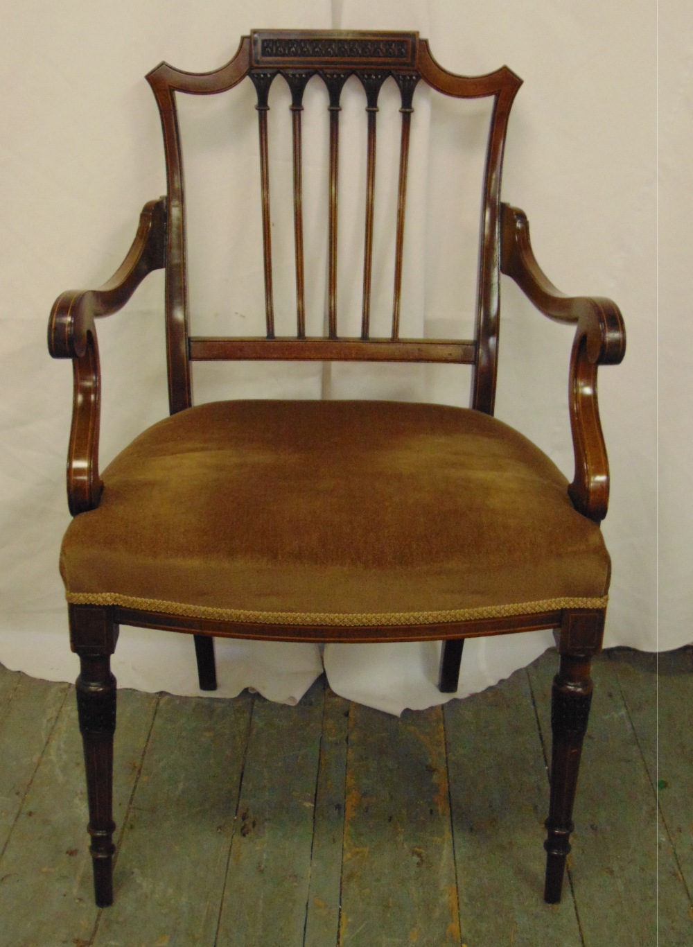 An Edwardian mahogany inlaid occasional chair with slatted pierced back on turned cylindrical legs