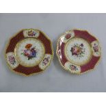 A pair of Coalport hand painted cabinet plates with central floral sprays