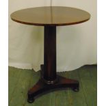 A mahogany circular occasional table on pedestal triform base