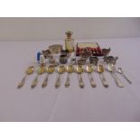 A quantity of silver and white metal to include condiments, cased teaspoons