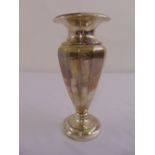 A silver vase with tapering panelled body on raised circular base
