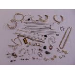 A quantity of silver and costume jewellery to include necklaces, bangles, earrings and rings