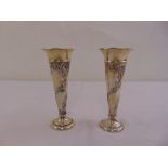 A pair of William Comyns silver vases tapering cylindrical on raised circular bases