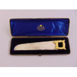 A late Victorian miniature hand saw with hallmarked silver blade and ivory handle, London 1895