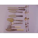 A quantity of silver and white metal spoons and servers