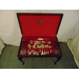 Oneida canteen of silver plated flatware in leather top display case on four cabriole legs