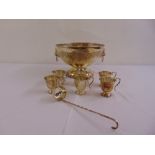 A silver plated punch bowl, six silver plated cups and a silver plated ladle