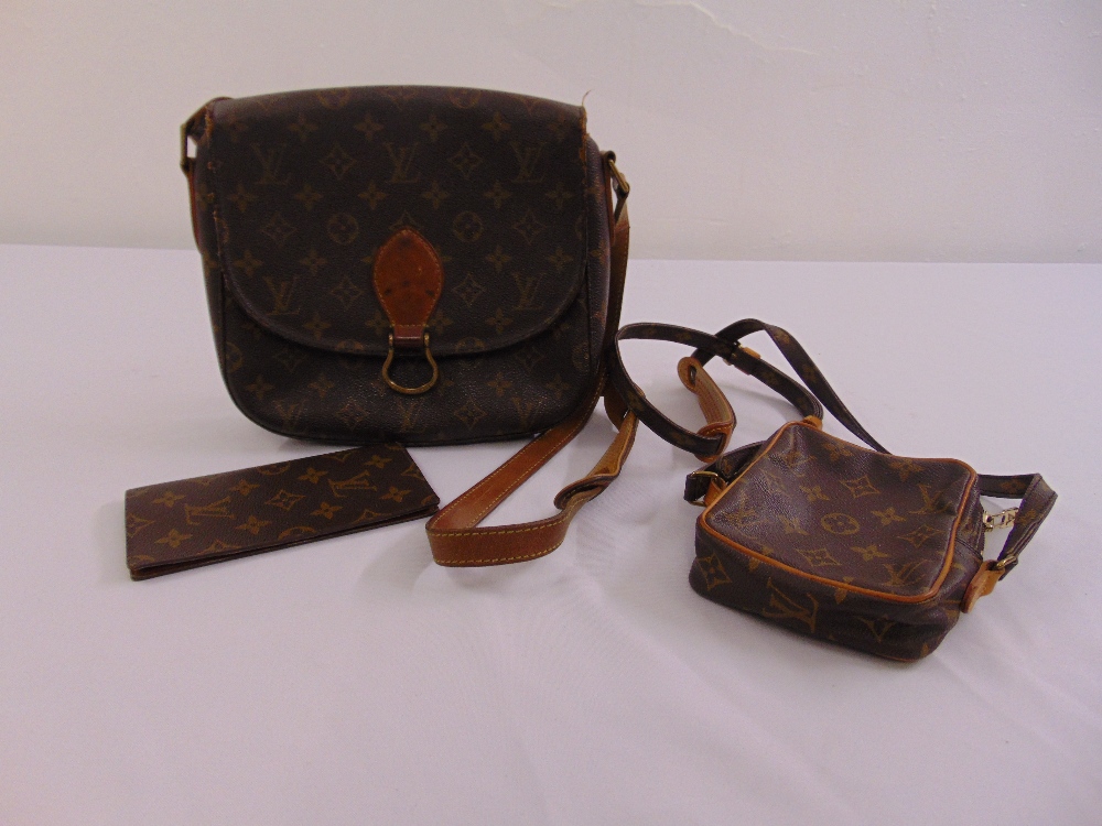 A Louis Vuitton satchel bag, a Louis Vuitton small utility bag and Louis Vuitton wallet