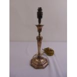 A hallmarked silver candlestick, tapering octagonal form on raised octagonal base, converted to an