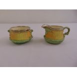 Royal Worcester sugar bowl and milk jug with hallmarked silver rims