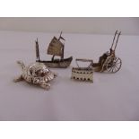 A quantity of novelty silver and white metal to include a rickshaw, a junk, an iron on stand, and