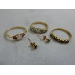 A quantity of 9ct gold jewellery to include three rings set with various coloured stones and a