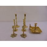 Three pairs of brass candlesticks and a chamber stick with accompanying snuffers