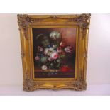 A framed oil on canvas still life painting of flowers in the 17th century Dutch style, 59 x 49cm