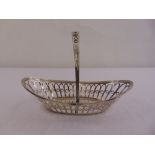 A silver oval pierced roll basket with pierced swing handle, Sheffield 1906 by James Dixon and sons