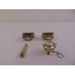 A pair of silver salts, a silver cheroot holder and a white metal tea infuser in the form of a