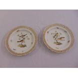 A pair of KPM Berlin hand painted cabinet plates decorated with birds and butterflies