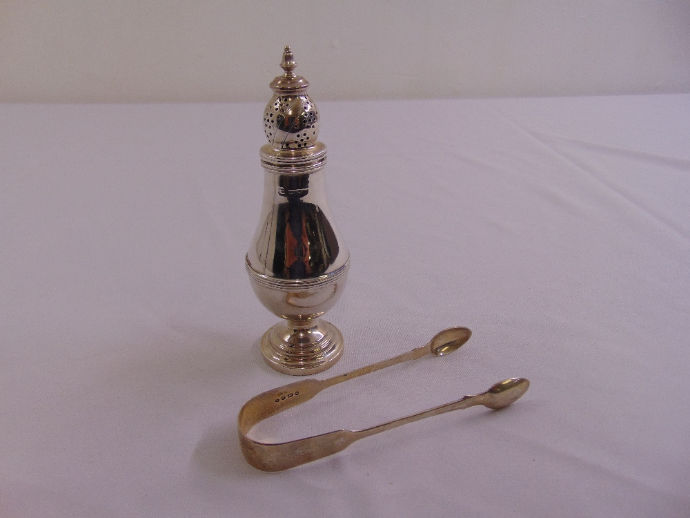A silver sugar sifter pear shaped with pierced pull of cover, Chester 1901 and Victorian silver