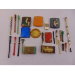 A quantity of Art Deco cigarette cases and cigarette holders and a lighter (22)