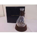 A Ralph Lauren glass decanter and leather stand in original packaging