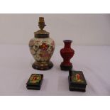 An Oriental porcelain lamp base, a cinnabar lacquer vase and two Russian lacquered boxes