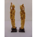 A pair of Chinese late 19th century ivory figurines of elders
