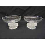 A pair of Lalique Nogent glass bowls with stylised bird stems and circular bases