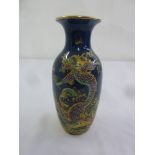 A Chelsea vase in the Chinese style decorated with a dragon, marks to the base, A/F