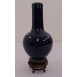 A Chinese 19th century blue ground baluster vase on carved and pierced hardwood stand