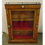 A French style rectangular display cabinet set with porcelain roundels and hinged glazed door on