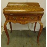 A French Louis XVI style marquetry desk of shaped rectangular form with bowed hinged top above a