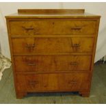 A rectangular walnut and mahogany chest of drawers with brass handles on four bracket feet
