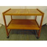 A mid 20th century rectangular tile top teak tea trolley