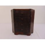 An early 20th century stained oak spice chest with four drawers