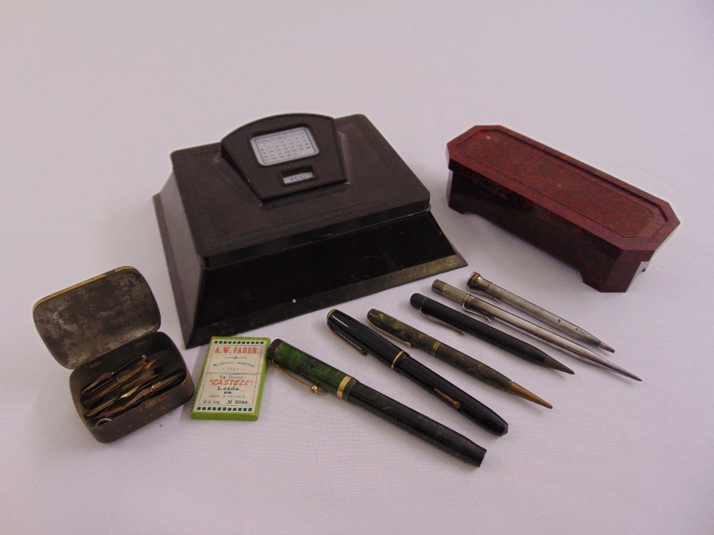 A Bakelite pen stand, a Bakelite rectangular box and six pen and pencils