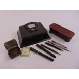 A Bakelite pen stand, a Bakelite rectangular box and six pen and pencils
