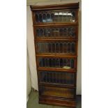 An early 20th century six section Globe Wernicke with lead lined glass panels and bottom drawer