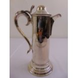 A silver plated presentation claret jug of cylindrical form with scroll handle and hinged domed