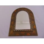 A brass and copper arched rectangular wall mirror