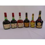 Four bottles of Courvoisier cognac, a bottle of Benedictine and a bottle of Bols Monastique